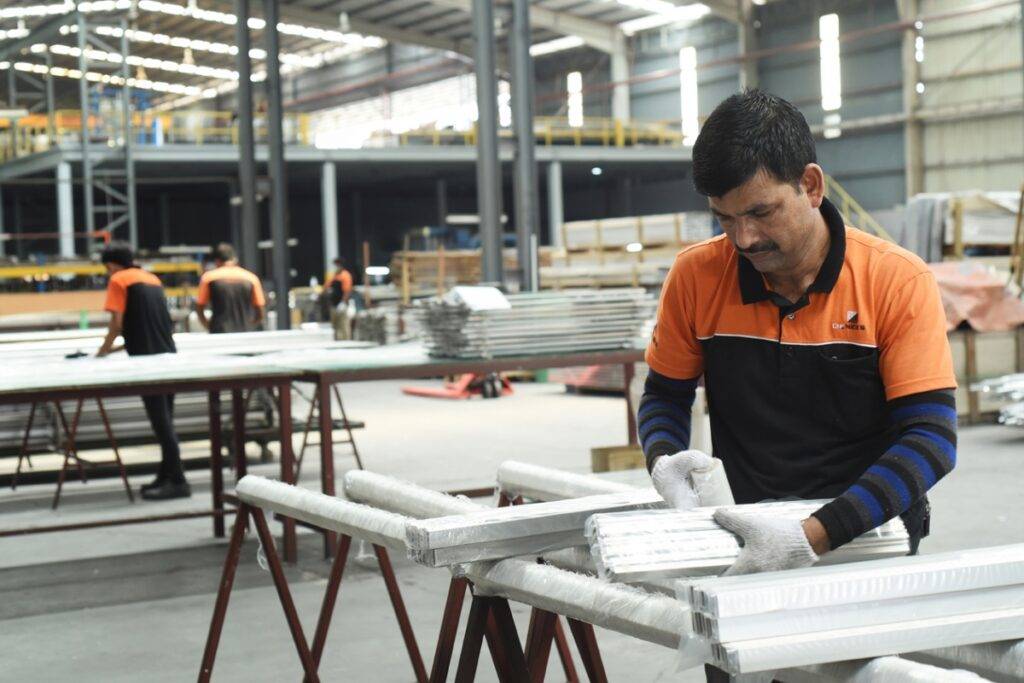 Man working at aluminium product workshop